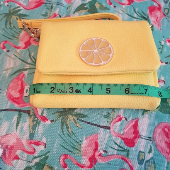 Charming Charlie Handbags - 2/15$ Nwt Lemon clutch light yellow color